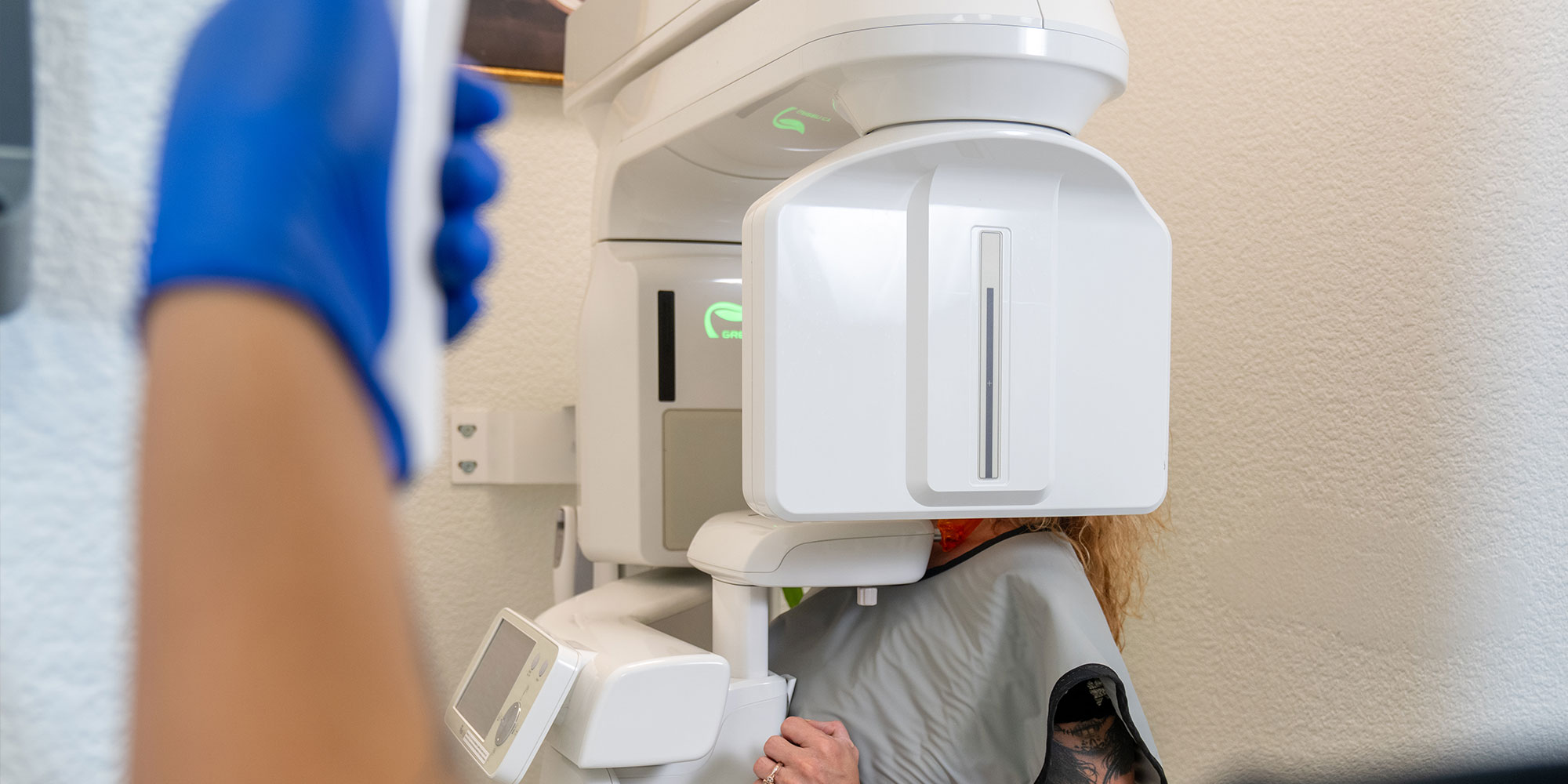 Paitent taking a dental x-ray of their teeth