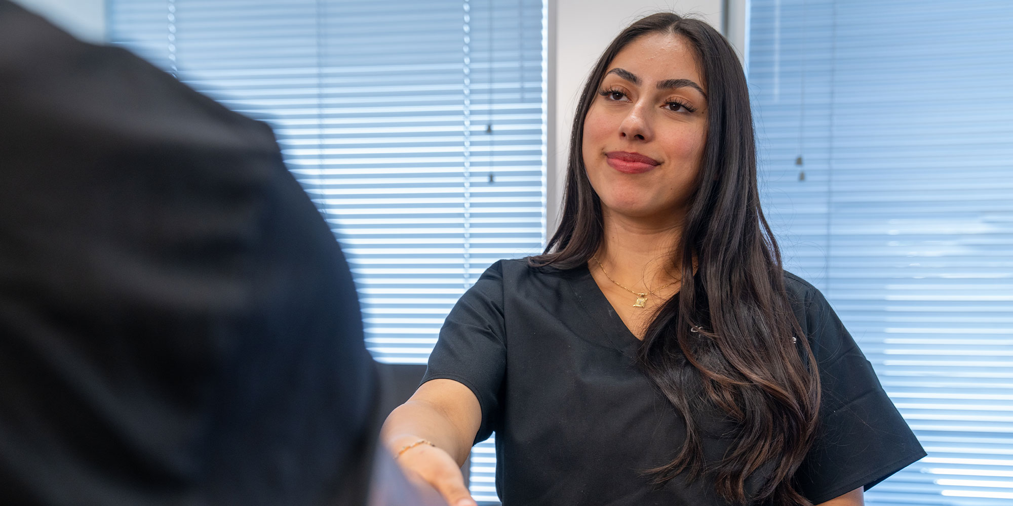 team member shaking Patients hand